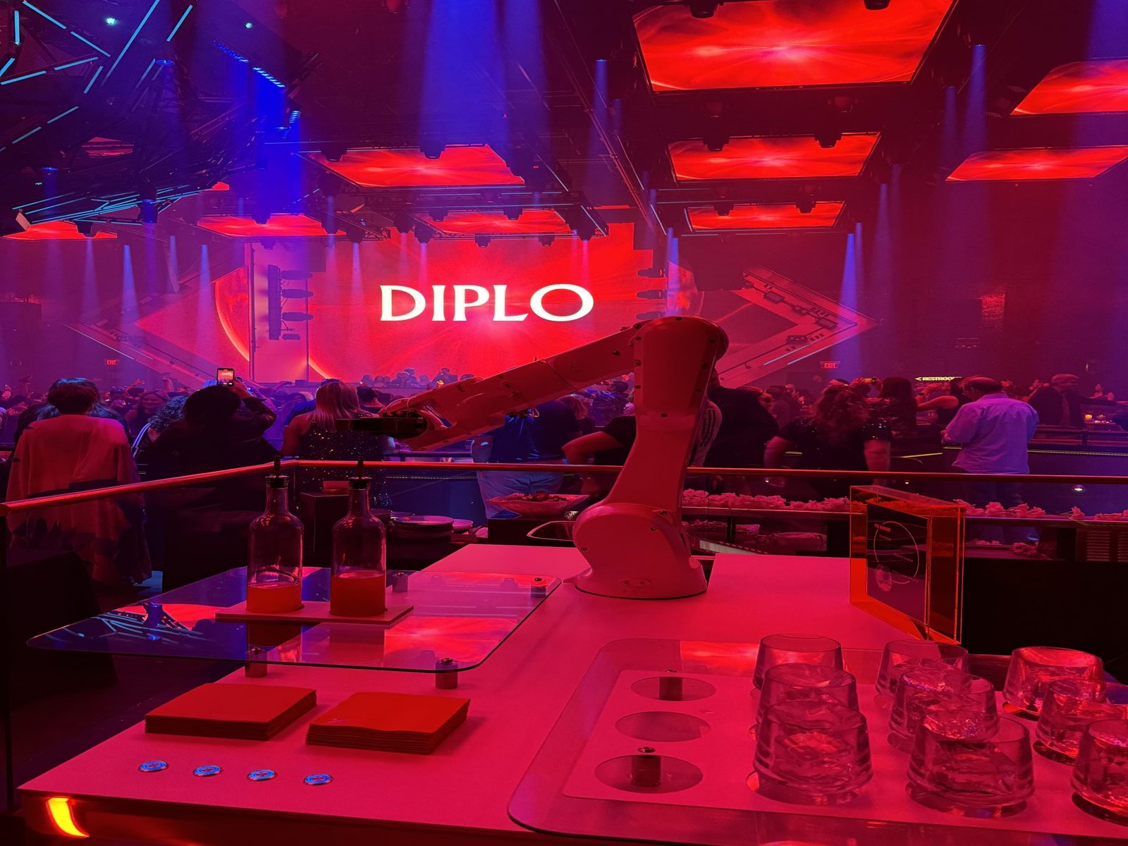 RoboBar robot bartender serving drinks to a crowd at a live event