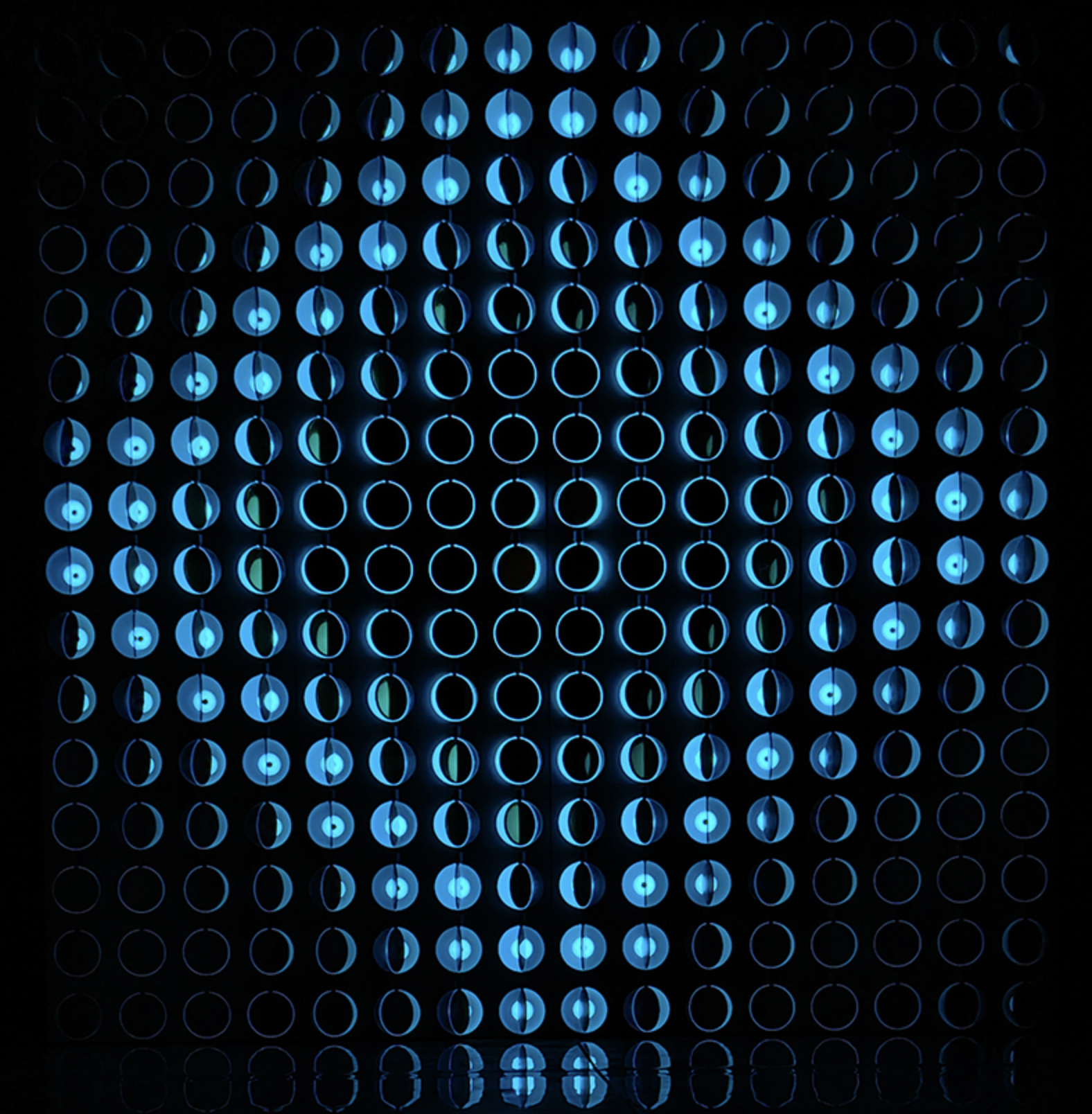 Infinity Matrix Screen — illuminated reflective disc panel in blue light