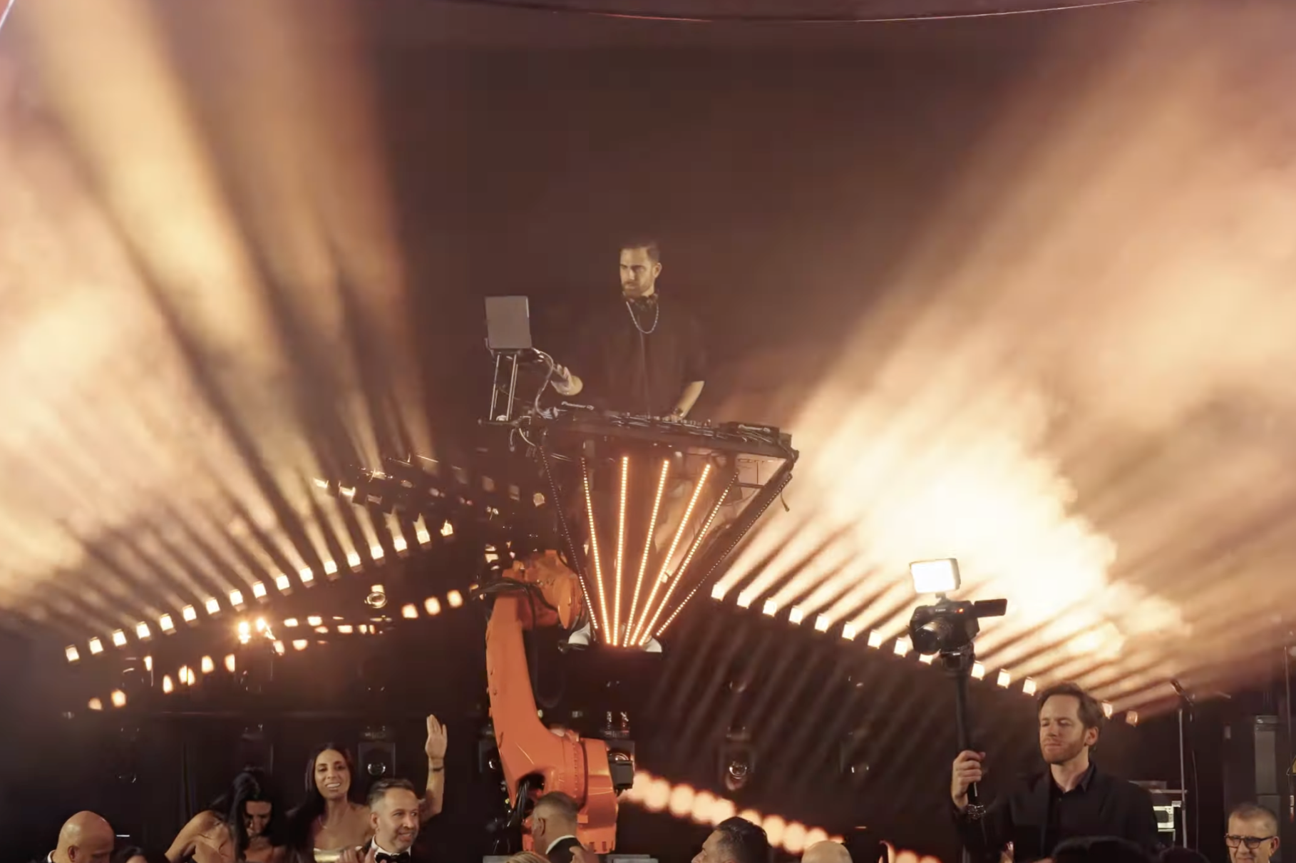 SkyNova robot DJ booth performance with the DJ elevated on a KUKA robotic arm