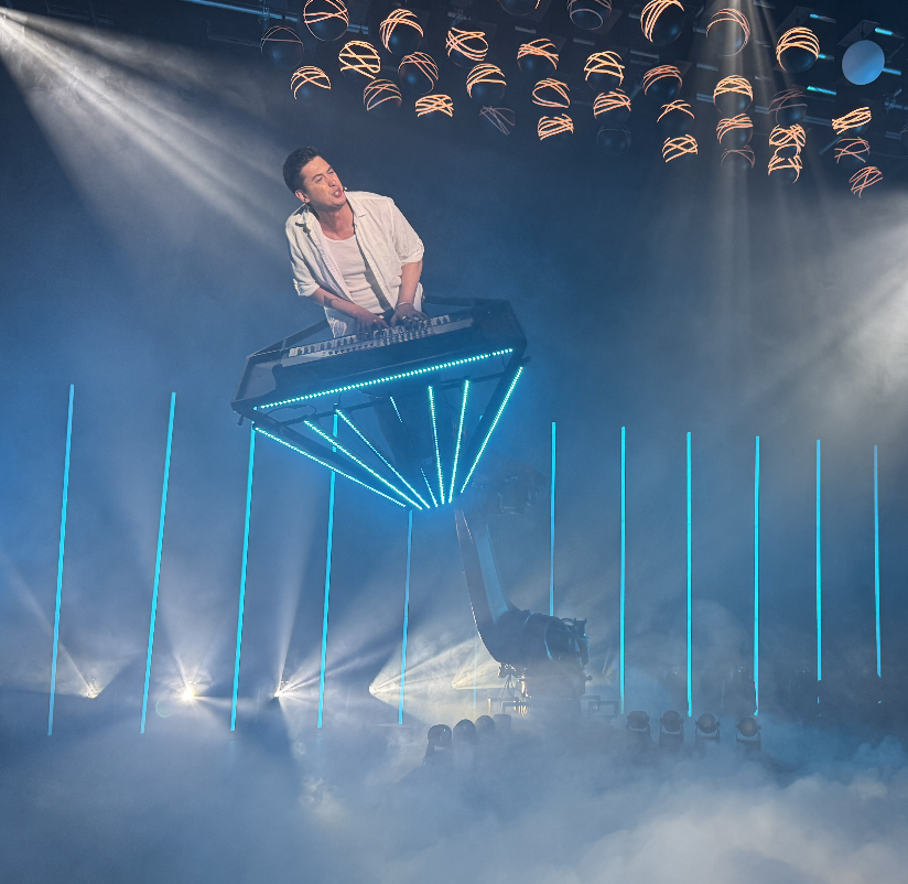 SkyNova DJ booth — robotic arm lifting the DJ above the crowd