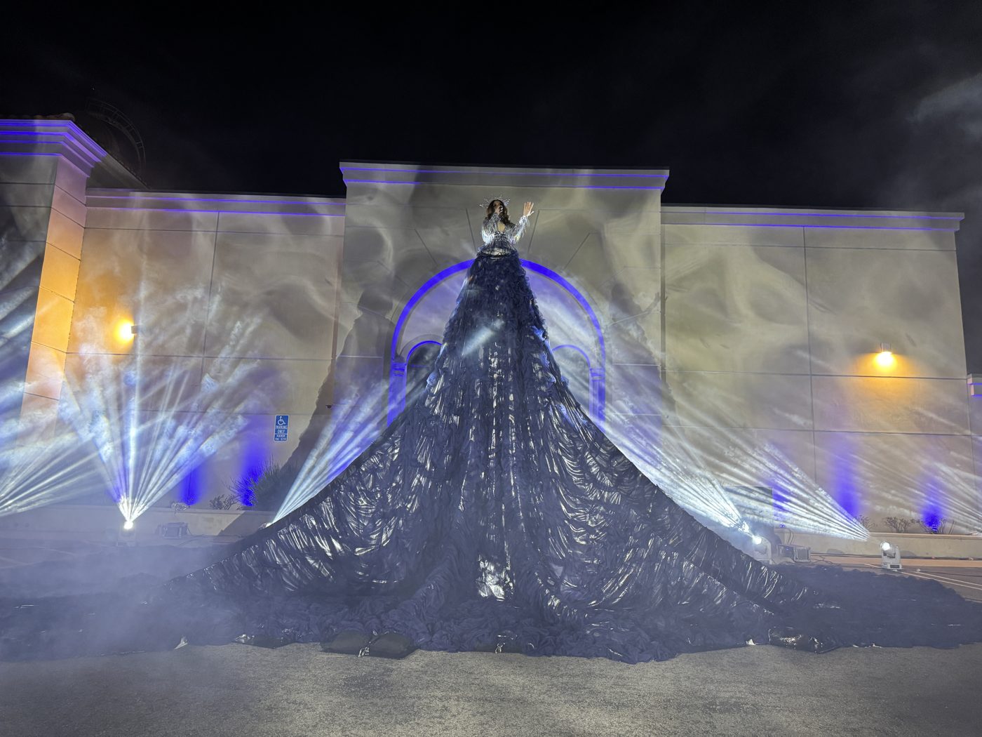 Vocalist on a giant illuminated gown driven by a hidden KUKA robot
