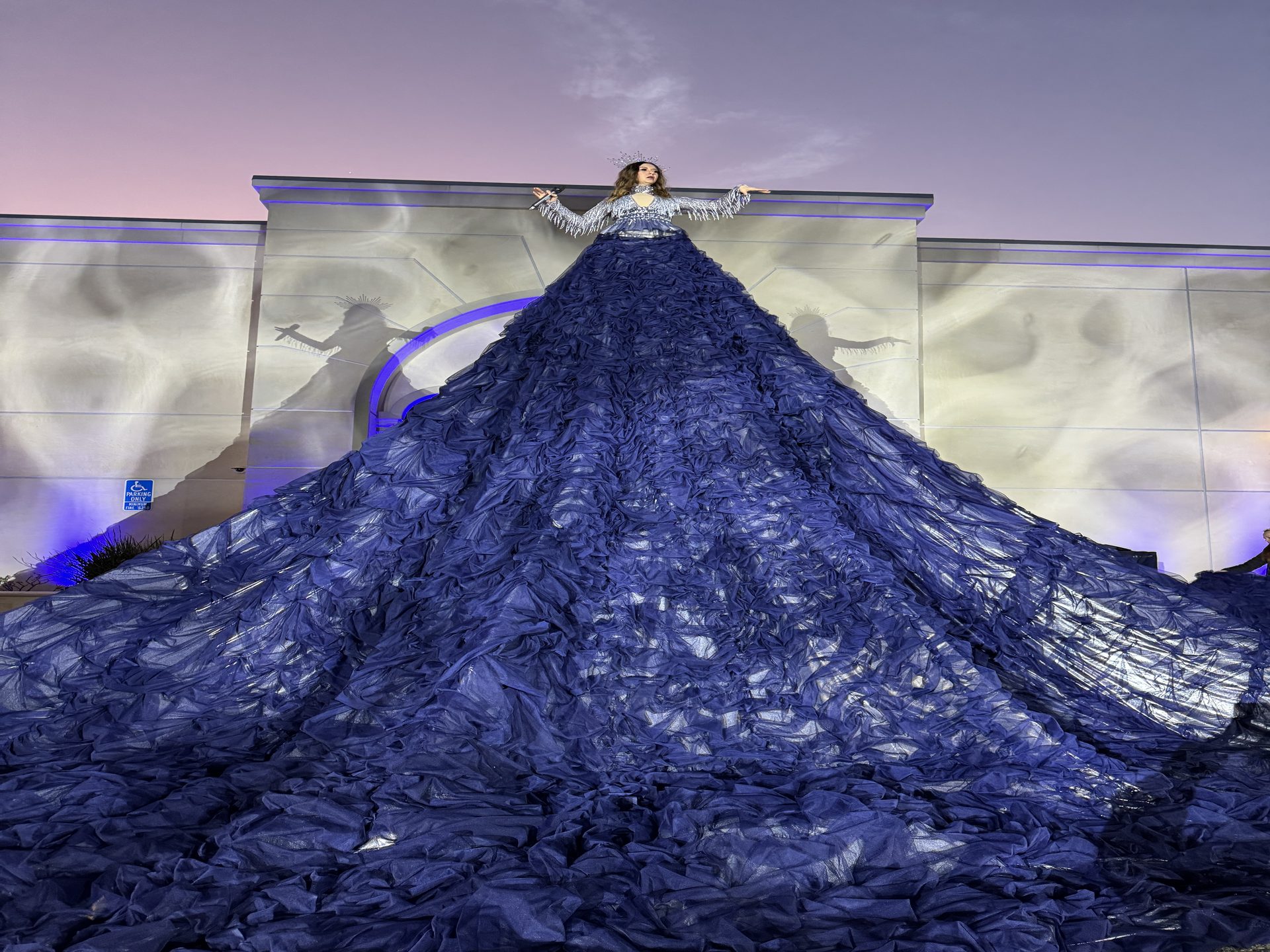 Vocalist atop a 40-foot custom illuminated gown driven by a hidden KUKA robot