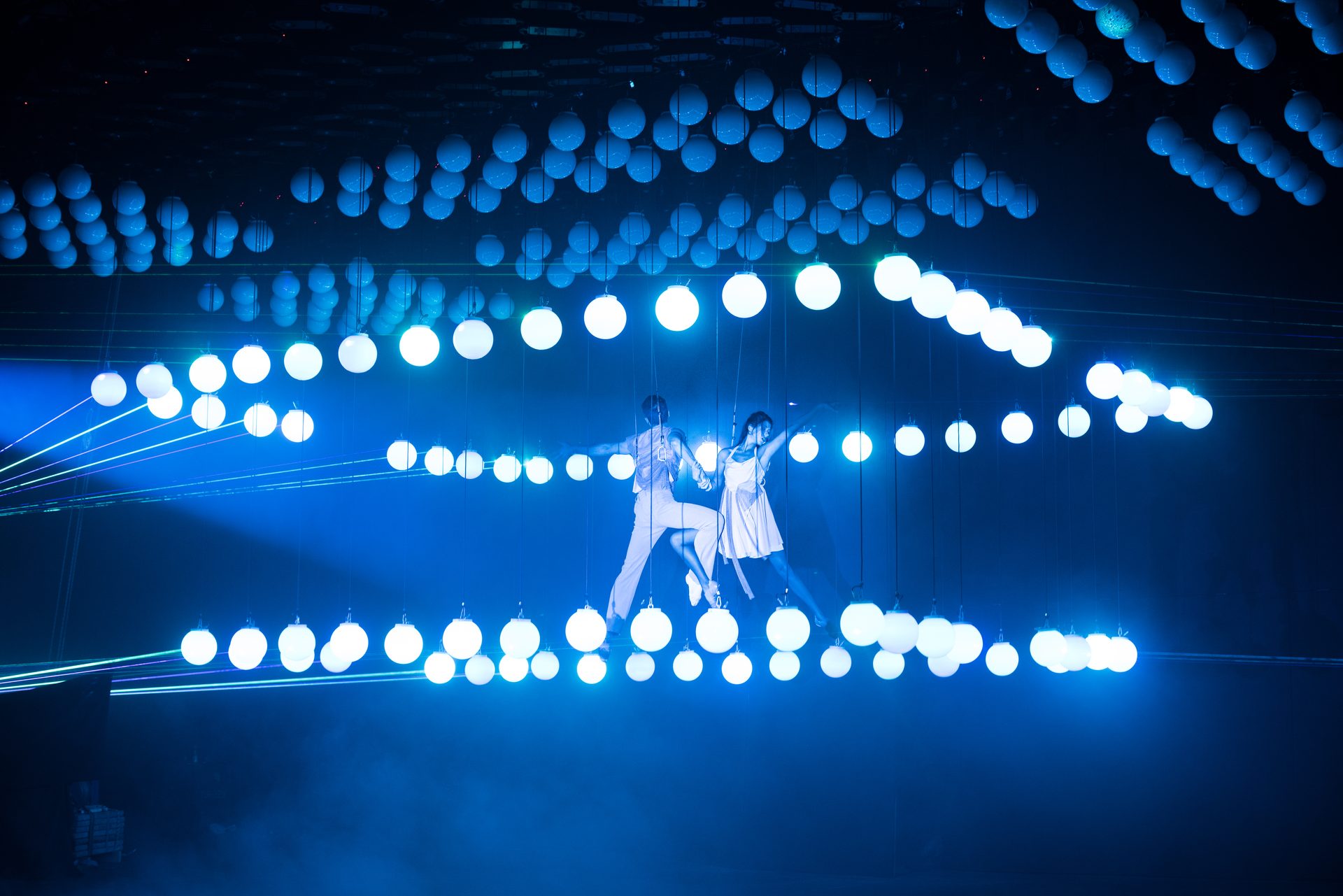 Two aerial performers among 280 illuminated kinetic spheres