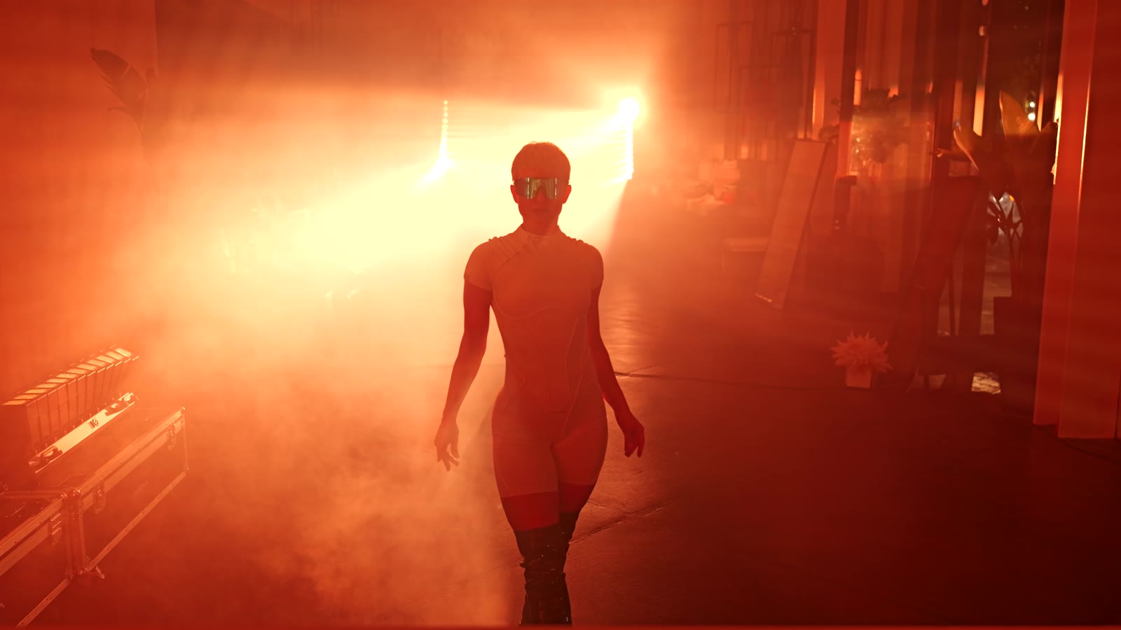 Night Pulse — a performer walking through haze and light in a Los Angeles boutique after dark